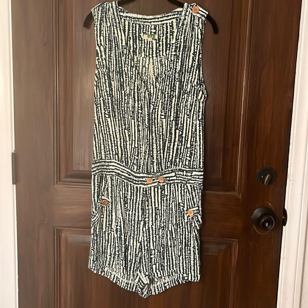Cute green and cream romper with wooden buttons